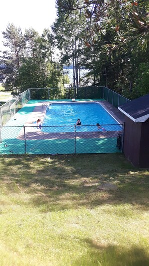 Seasonal outdoor pool, open 10:00 AM to 9:00 PM, pool loungers