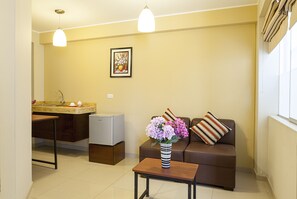 Apartment | Living room | 32-inch LCD TV with cable channels, TV, iPod dock