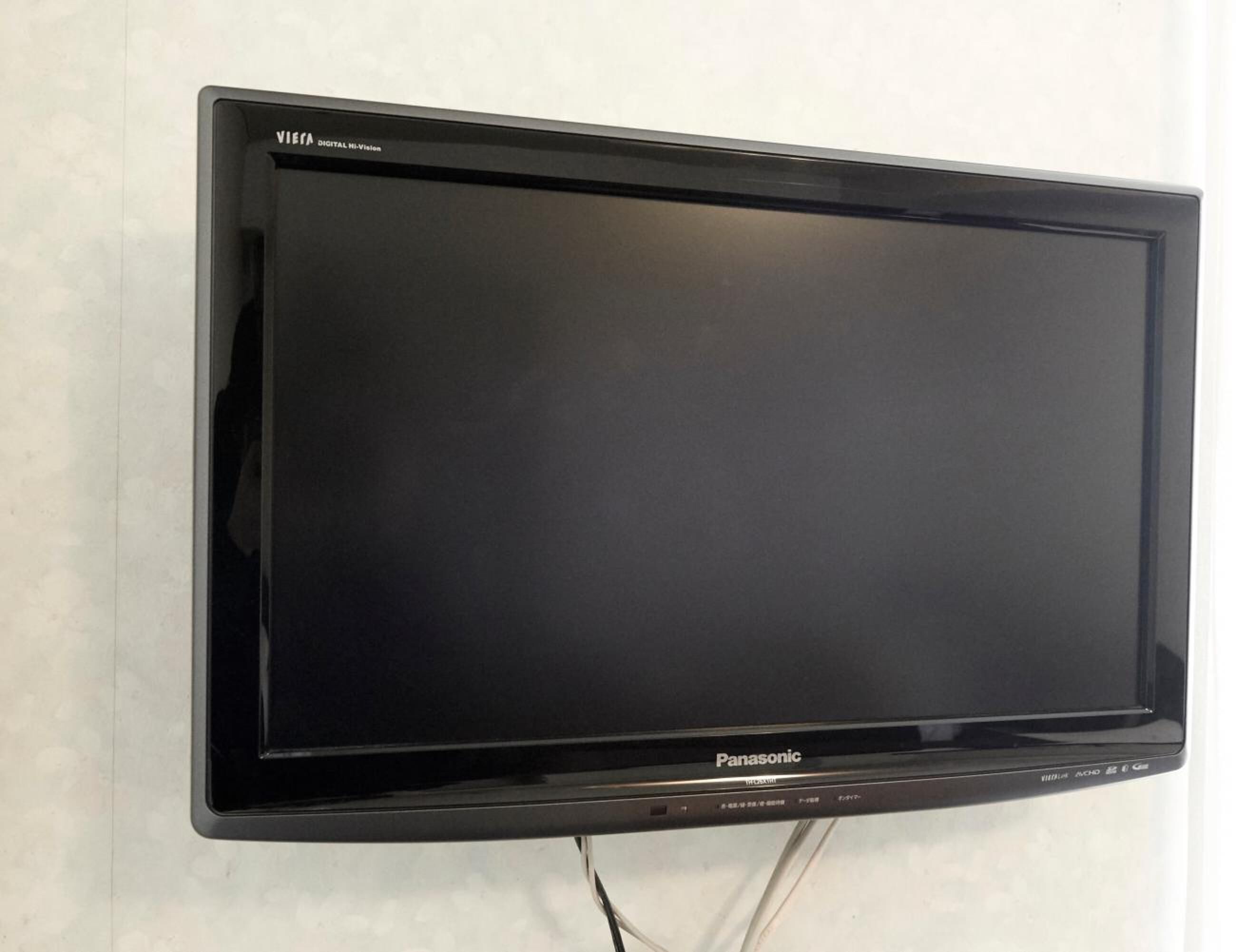 A Panasonic flat-screen TV mounted on a wall.