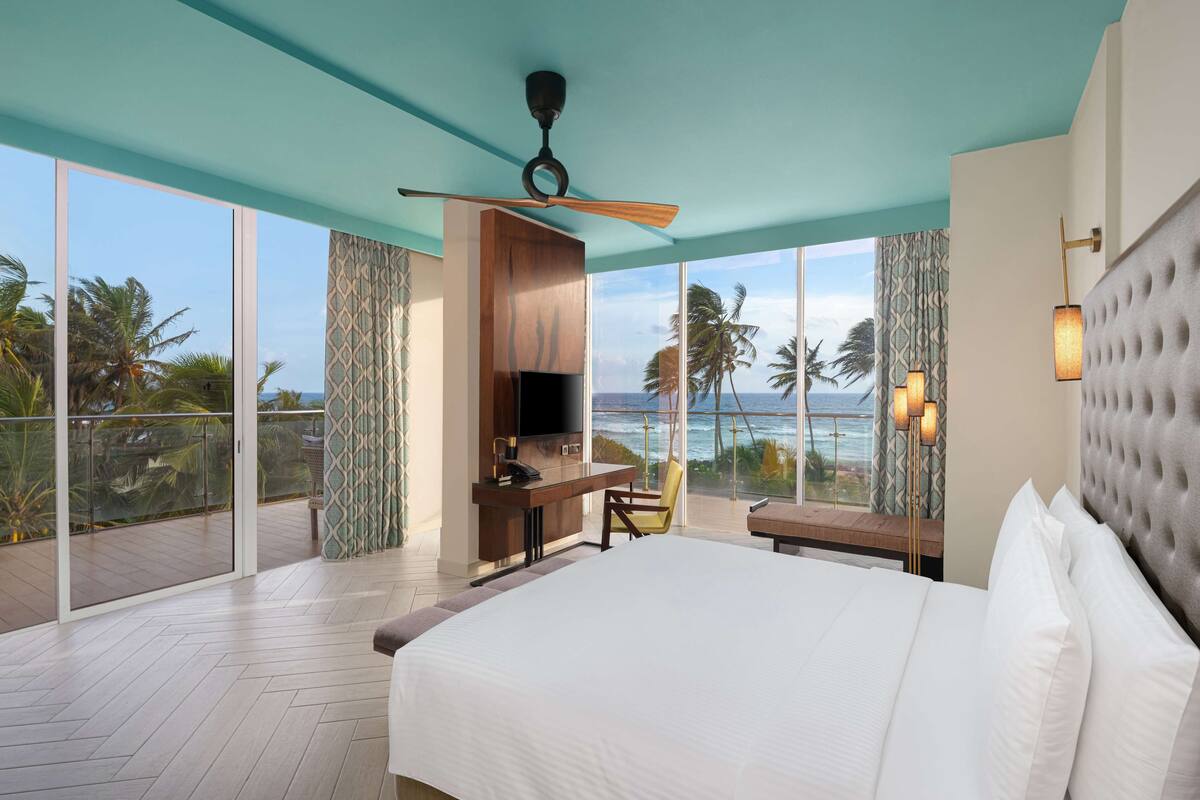 junior suite, ocean view with  15% discount on food and soft beverages | 1 bedroom, minibar, in-room safe, desk