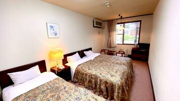 Basic Triple Room, 3 Single Beds, Non Smoking, Private Bathroom | Desk, soundproofing, free WiFi, bed sheets