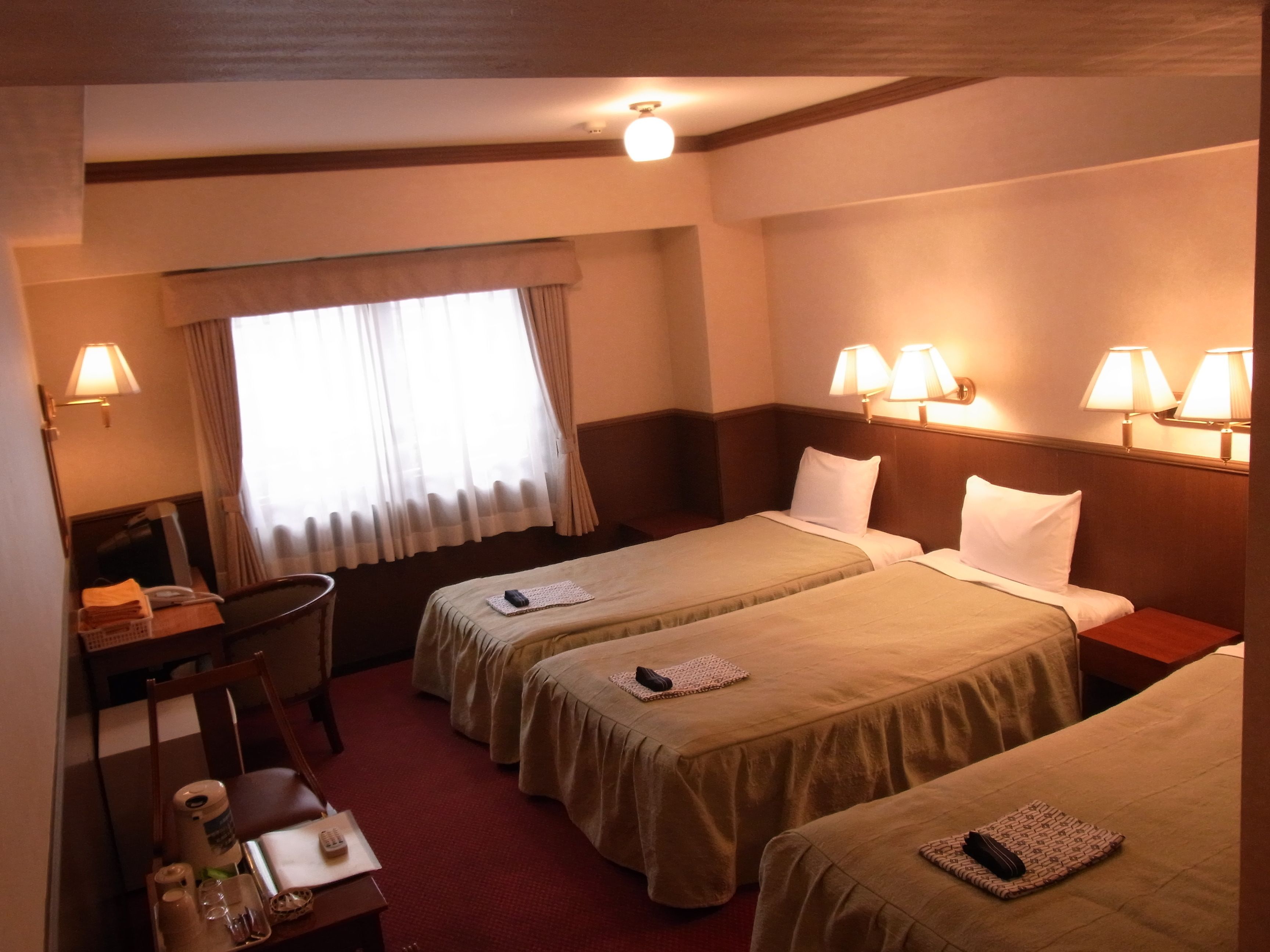 laptop workspace, blackout curtains, free wifi, bed sheets