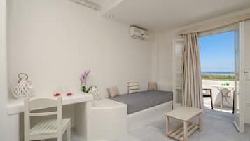 Deluxe Apartment | Living area | 24-inch TV with satellite channels