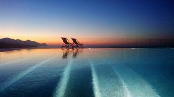 Outdoor pool, open 9:00 AM to 7:00 PM, pool umbrellas, pool loungers