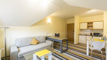 Premium bedding, desk, laptop workspace, iron/ironing board