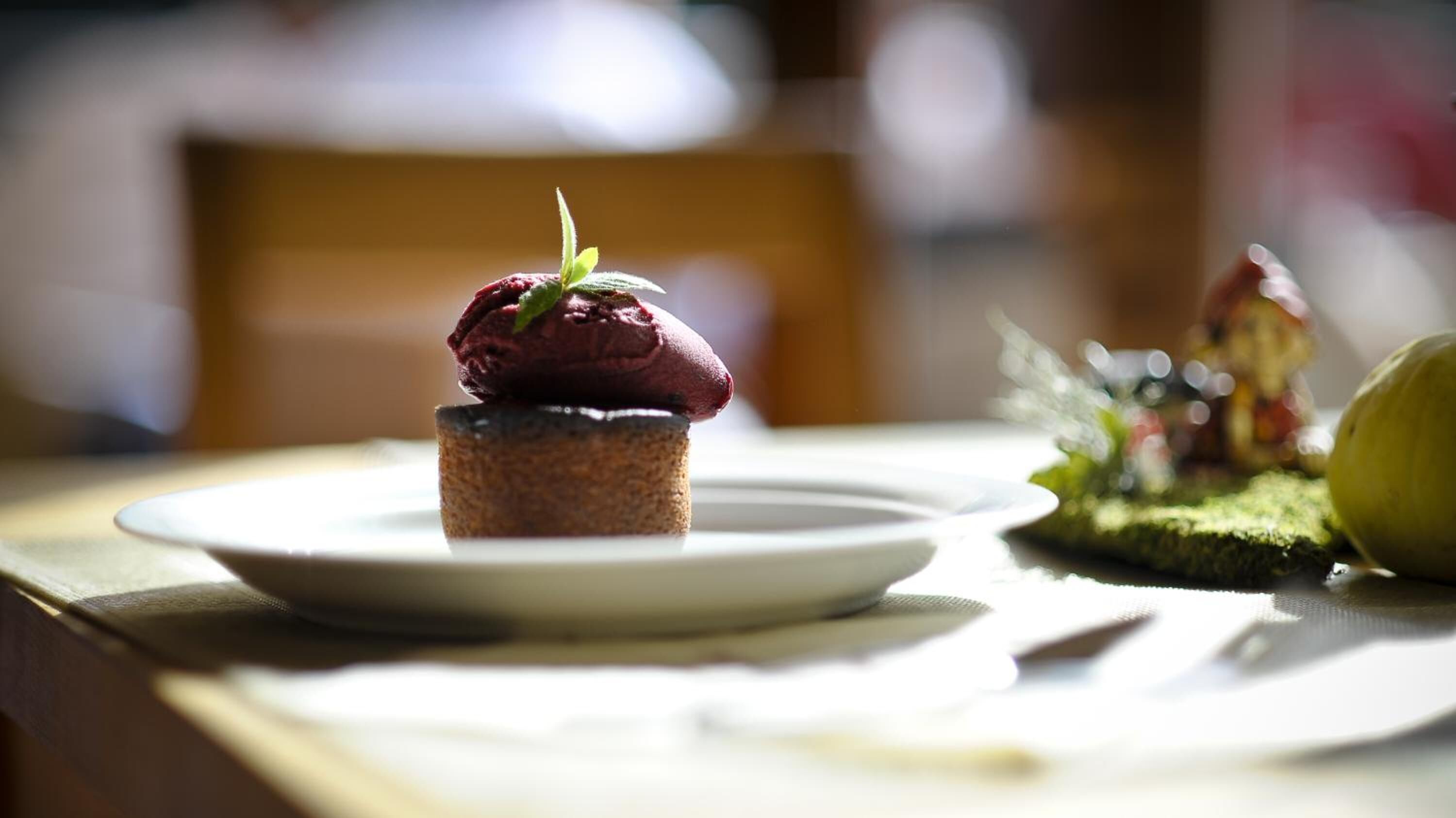 A dessert on a white plate with a blurred background.