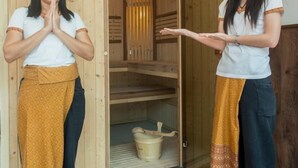 A wooden sauna room with a bench and a bucket. - Olympic Palace (Brazzaville)