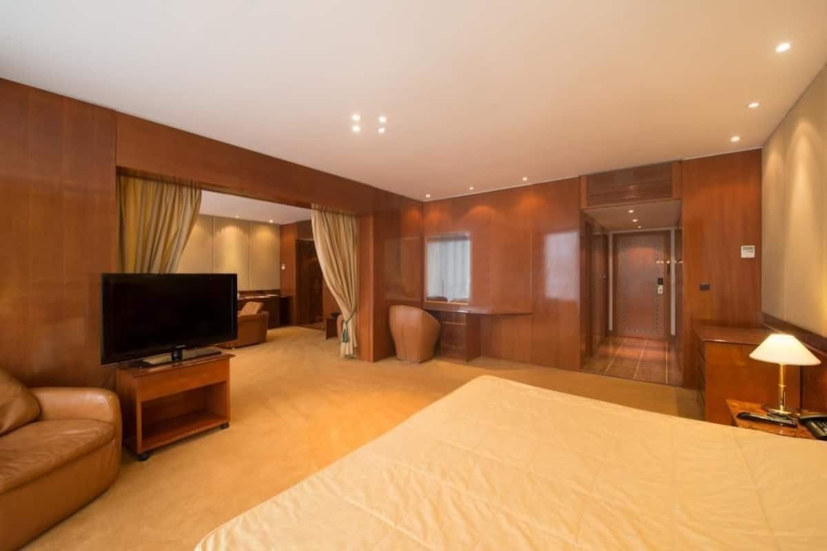Premium Suite | Minibar (some free items), in-room safe, desk, blackout drapes
