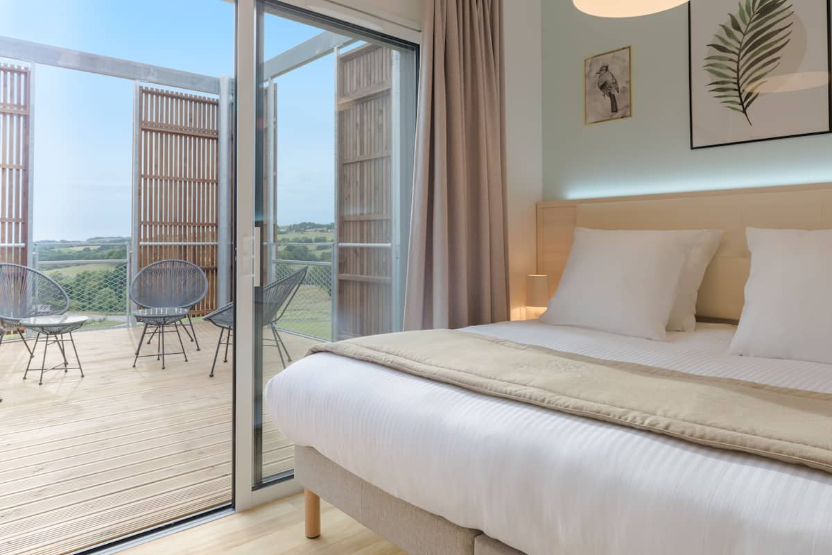 family room, balcony | premium bedding, in-room safe, individually decorated, blackout curtains