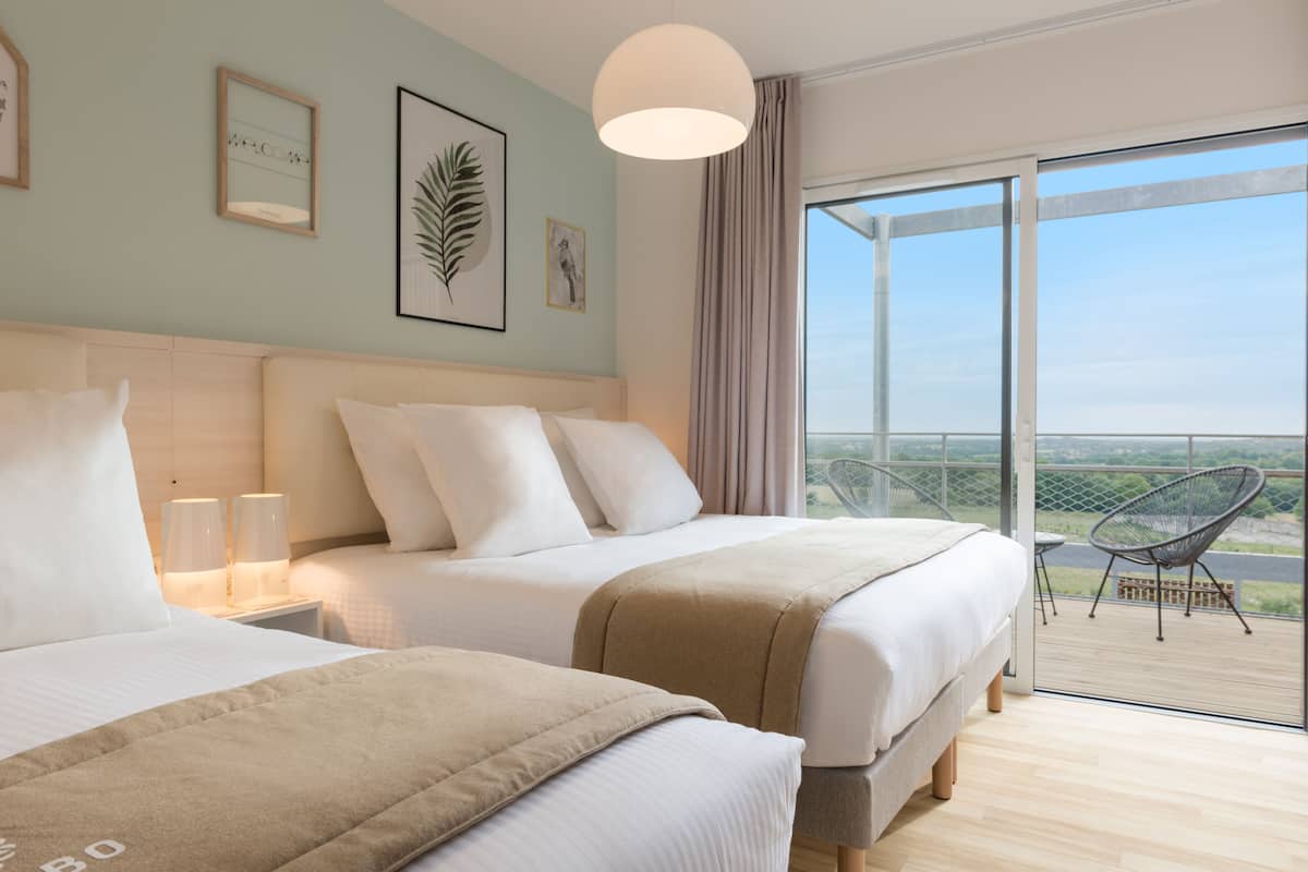 family room, balcony | premium bedding, in-room safe, individually decorated, blackout curtains