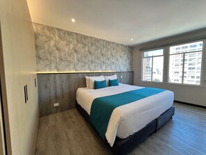 Junior Suite | Premium bedding, pillow-top beds, minibar, in-room safe - Hotel Grand Park (Bogotá)