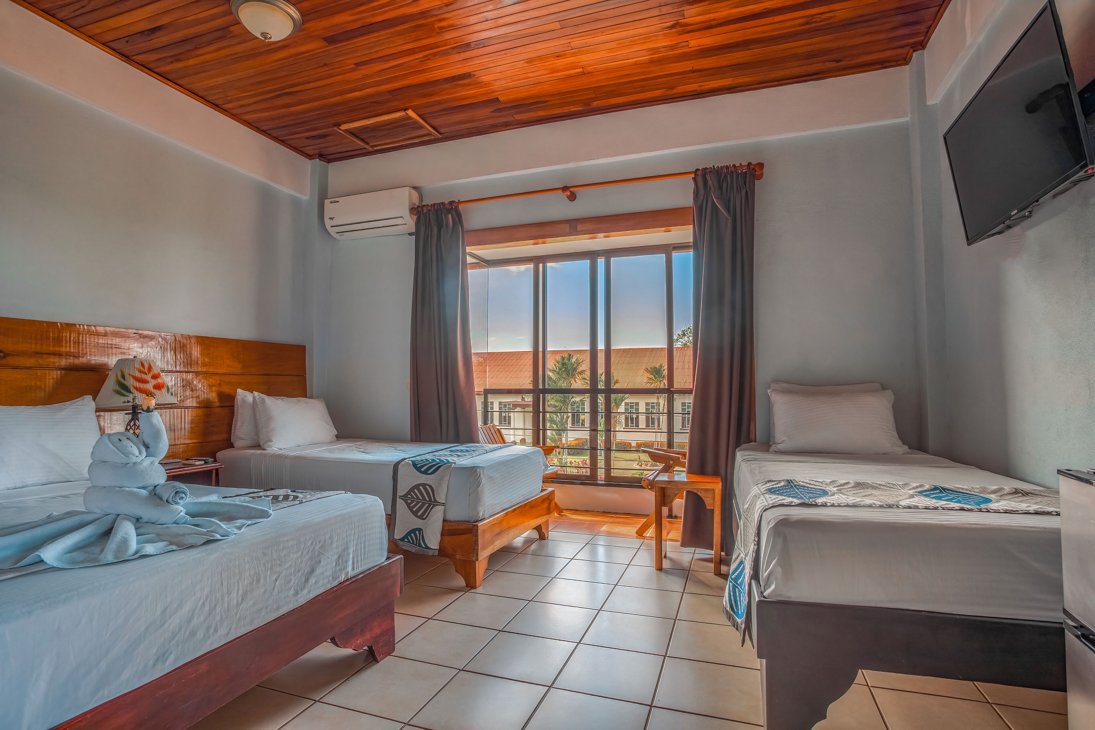 family quadruple room, private bathroom, pool view | city view