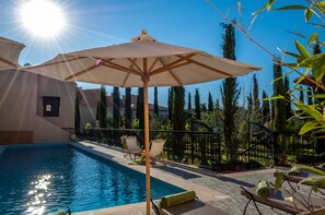 Outdoor pool, pool umbrellas, pool loungers