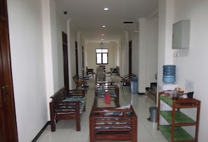 Guests can enjoy communal dining and socializing in this welcoming corridor with seating areas and convenient amenities.