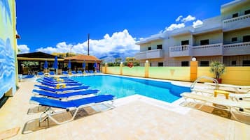 Seasonal outdoor pool, open 9:00 AM to 7:00 PM, pool umbrellas