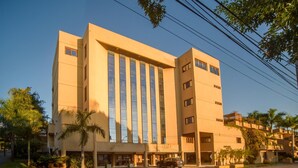 A large, modern hotel with a symmetrical facade, multiple floors, and a central entrance. - Andares Del Agua (Villa Elisa)