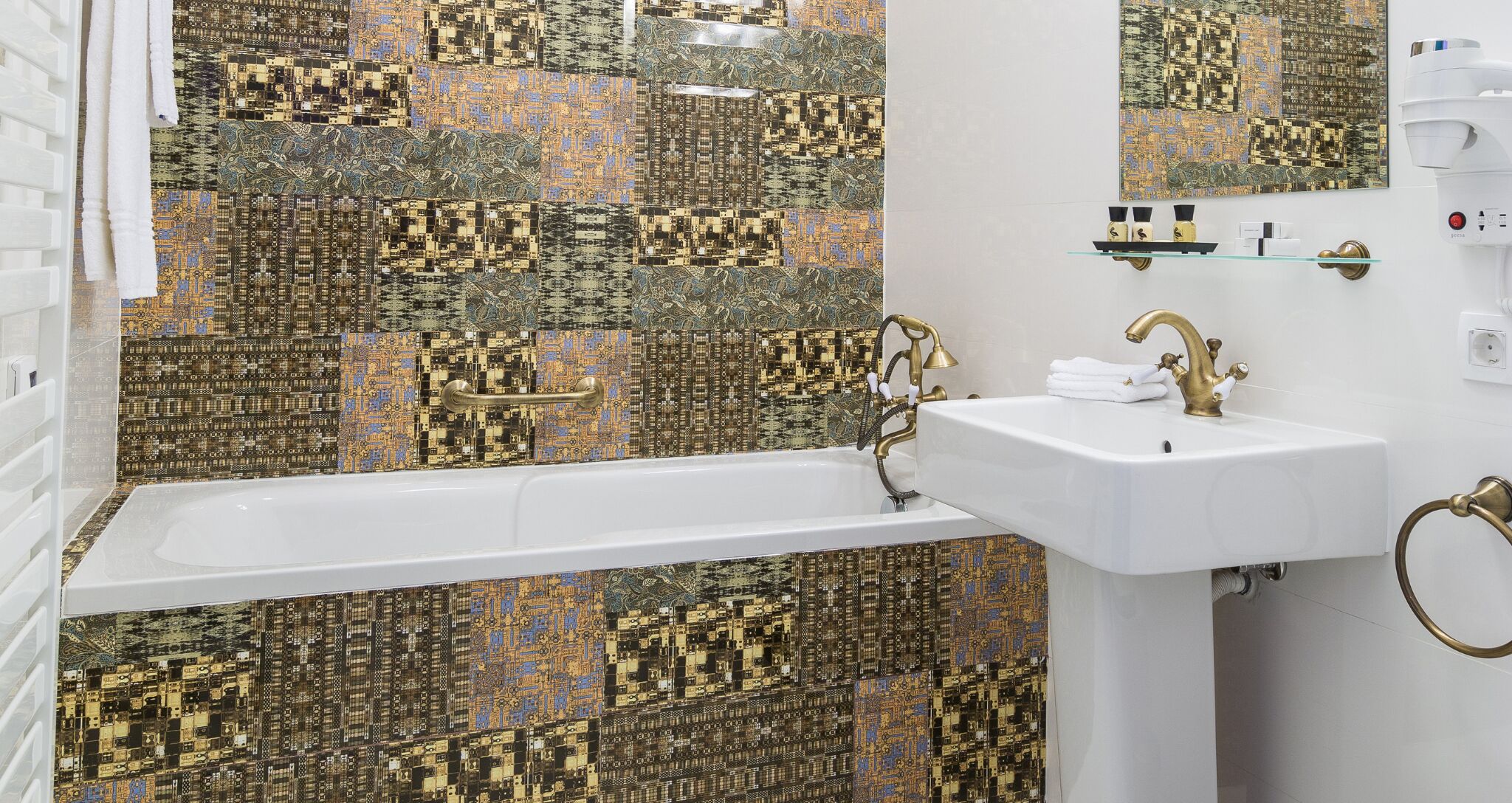 A bathroom with a bathtub, a white sink, and a mirror. The walls are decorated with a circuit board pattern.