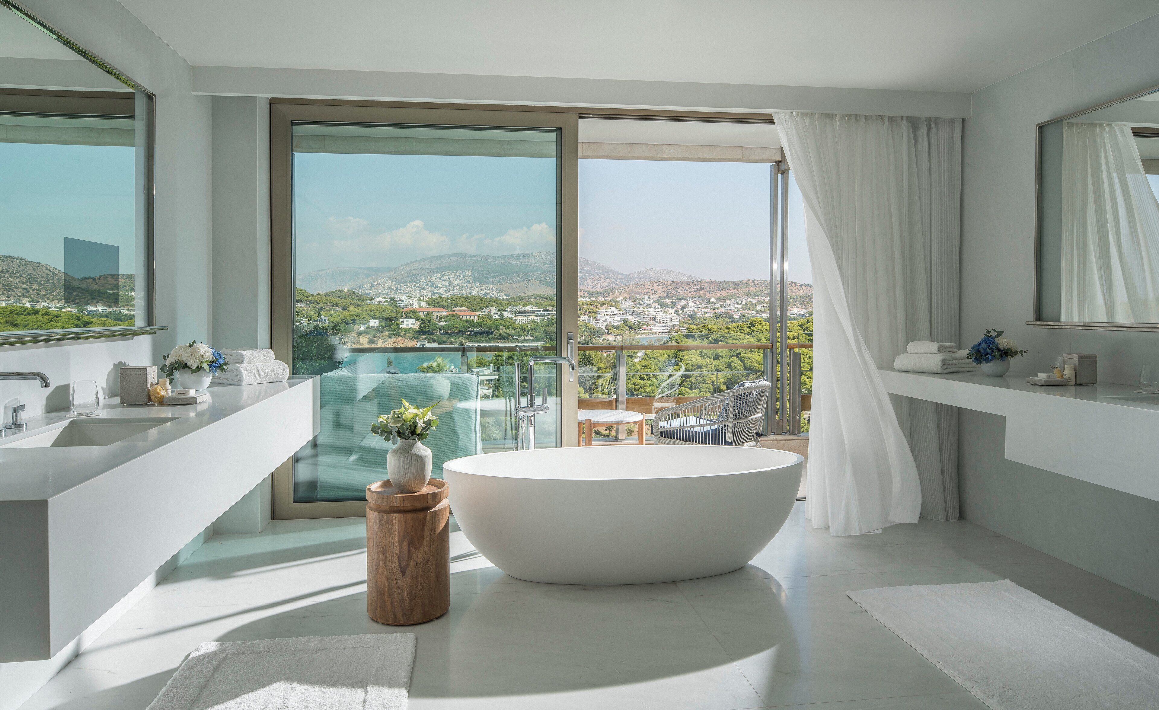 suite, non smoking (arion, riviera) | bathroom | separate bathtub and shower, designer toiletries, hair dryer, bathrobes