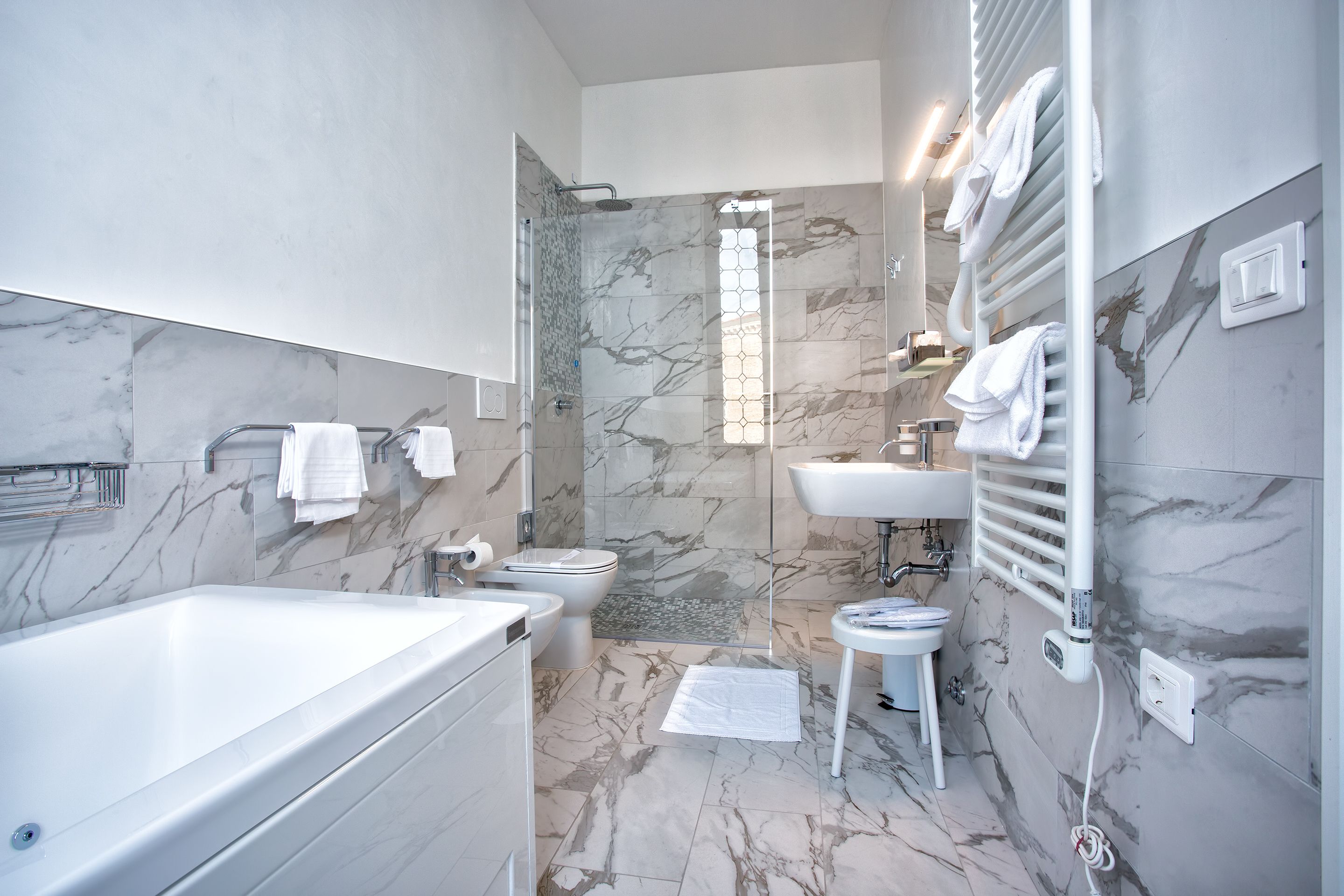 deluxe suite | bathroom | shower, free toiletries, hair dryer, bathrobes