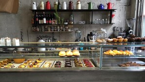 A bakery display case with various baked goods and a coffee machine. - The Artists' Palace Florence (Florence)