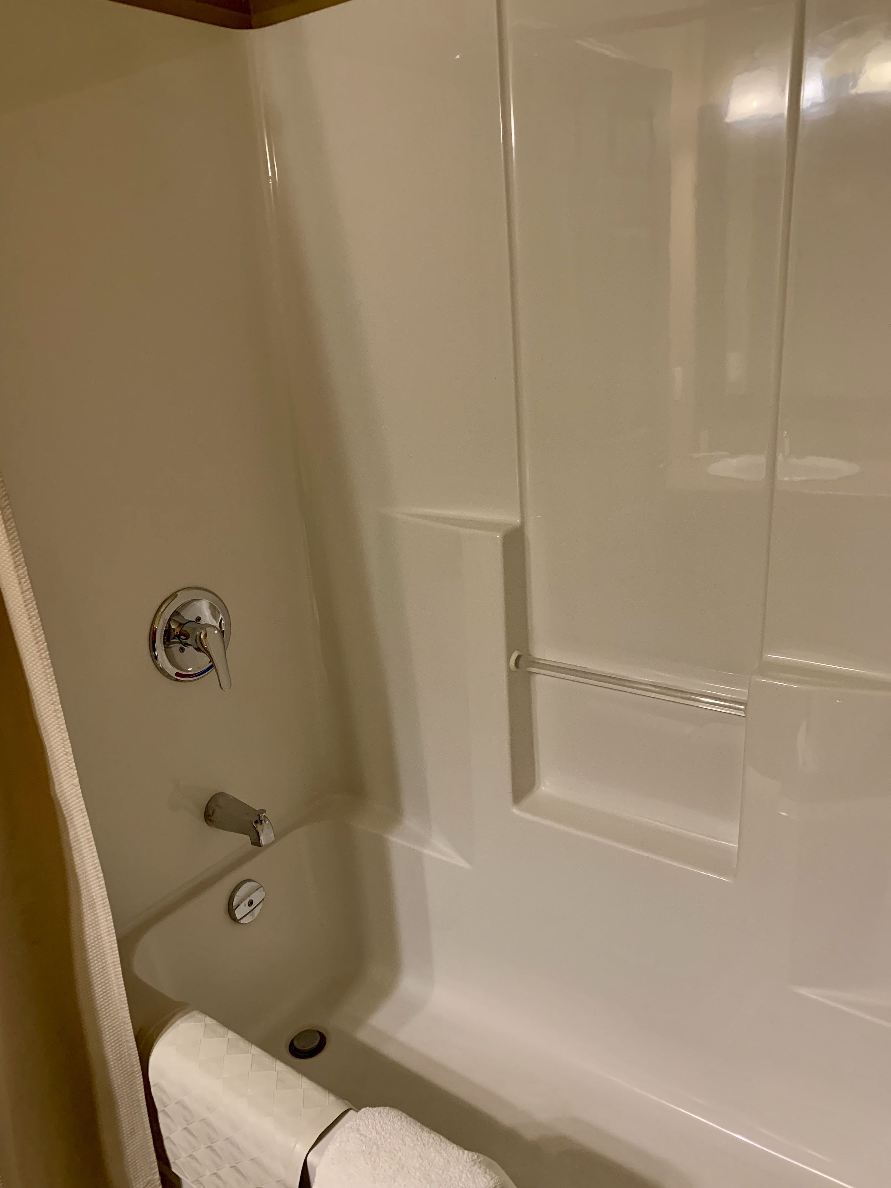 A bathroom with a bathtub, a shower, and a toilet.