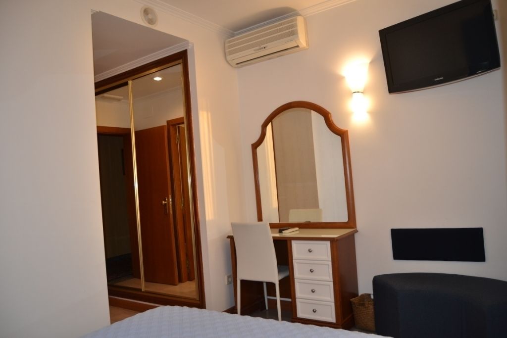 single room | premium bedding, desk, blackout curtains, soundproofing