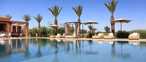Outdoor pool, open 8:30 AM to 8:00 PM, free cabanas, pool umbrellas