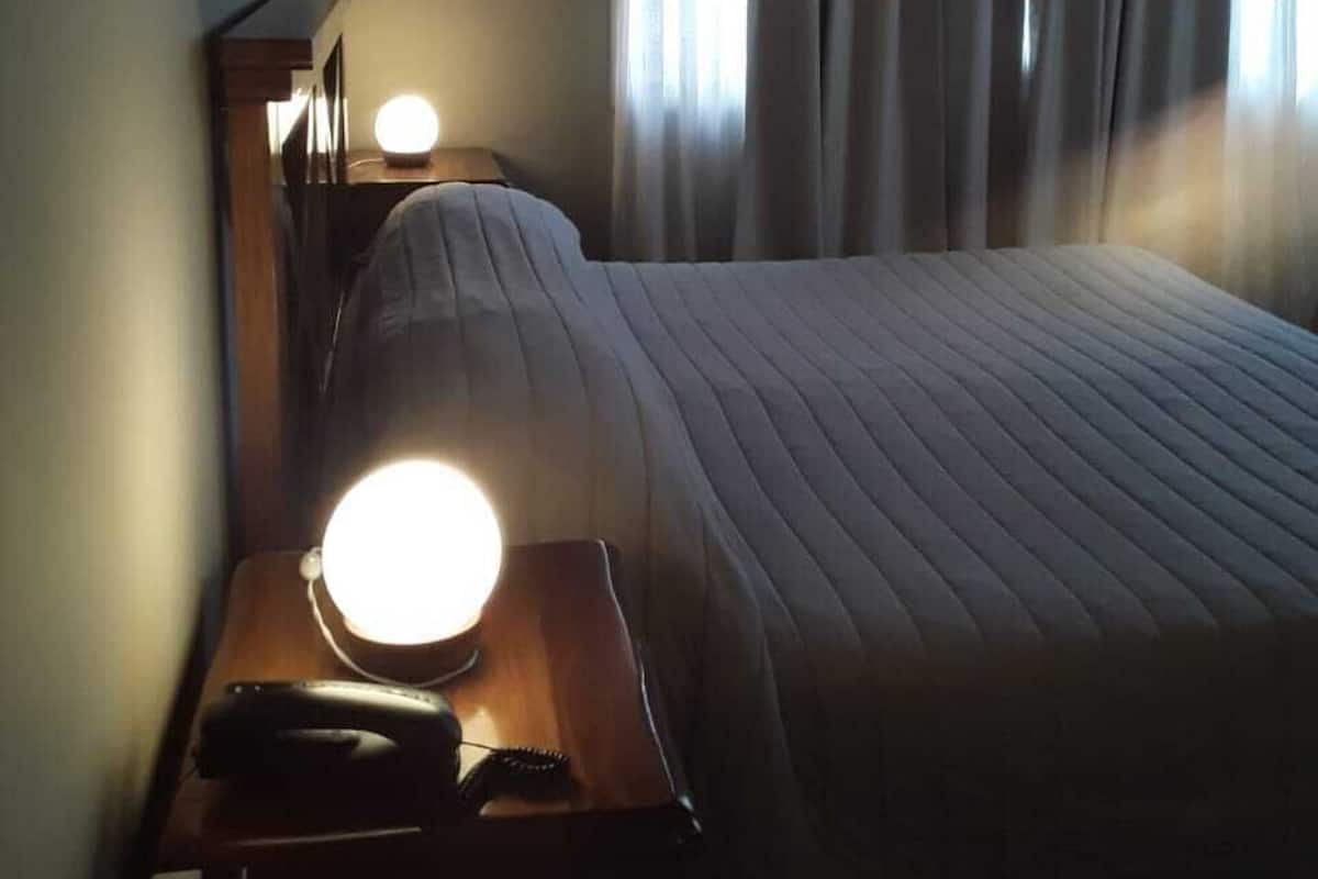 Quadruple Room | Down comforters, in-room safe, individually decorated, desk