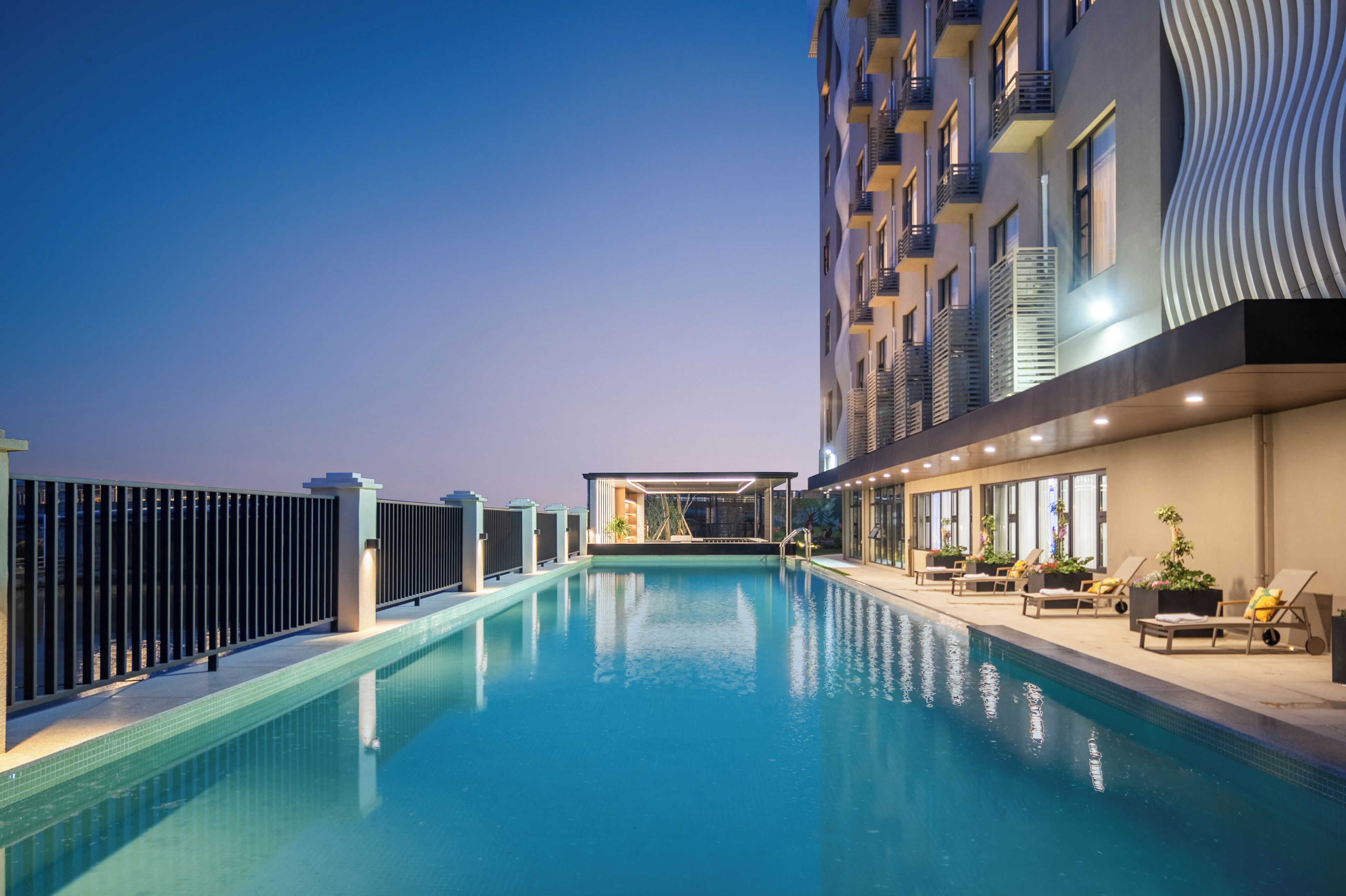 Seasonal outdoor pool, open 9:00 AM to 9:00 PM, pool umbrellas