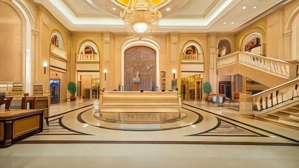 A spacious lobby with a central reception desk, a grand staircase, and a large decorative ceiling. - Vienna Hotel (Shanghai)