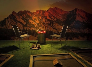 Two chairs facing a campfire with a mountainous backdrop. - Basecamp Boulder (Boulder)