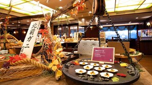 A restaurant interior with a sushi display, autumn decorations, and a sign indicating a seasonal menu.