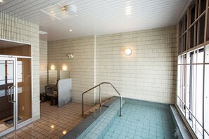 A swimming pool with tiled walls and a metal handrail. - Yumoto Takubokutei (Hakodate)