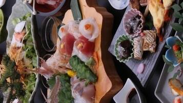 A variety of sushi and sashimi dishes on a wooden table.