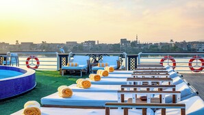 A rooftop pool area with sun loungers, a small pool, and lifebuoys. - Sonesta St George Nile Cruise  Ship - 3 & 7 Nights - From  Aswan  Every Friday (Luxor)