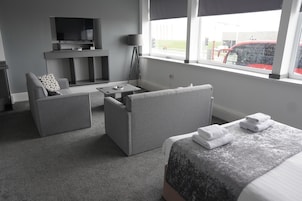 Superior Suite, Sea View | Living area | Flat-screen TV