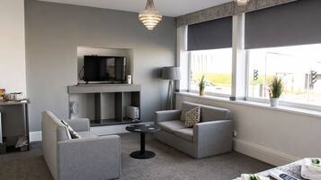 Superior Suite, Sea View | Living area | Flat-screen TV