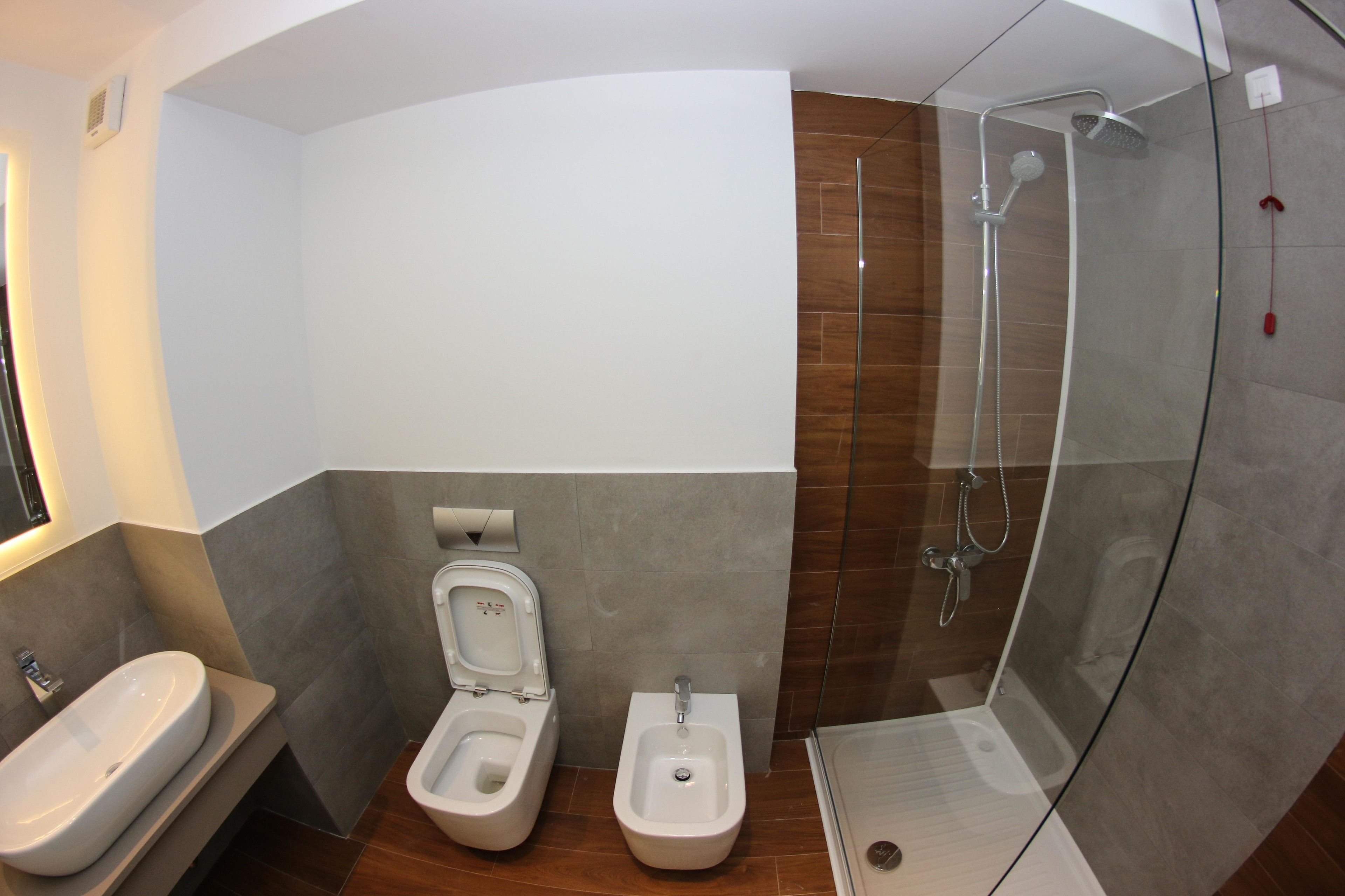 shower, designer toiletries, hair dryer, slippers