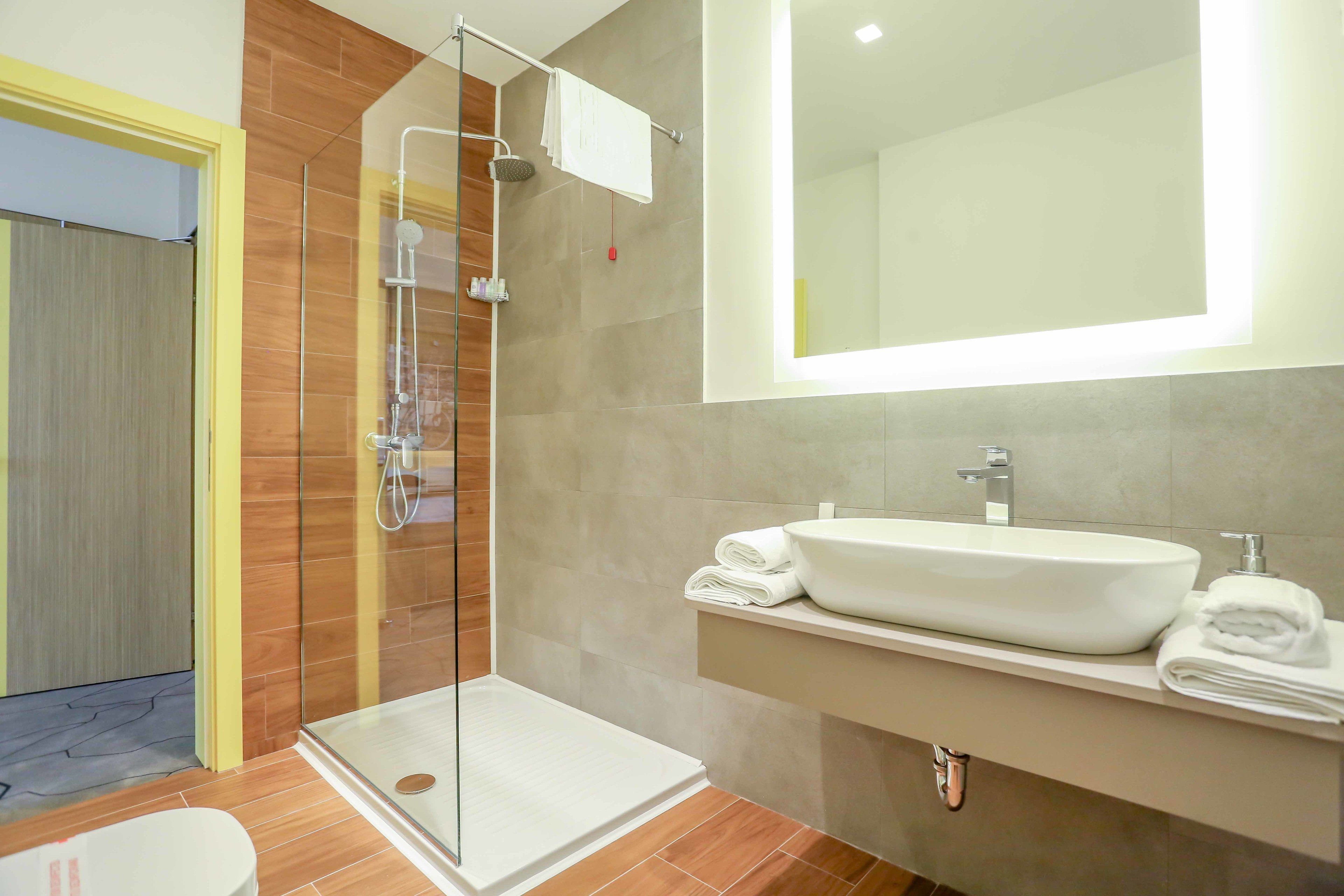 shower, designer toiletries, hair dryer, slippers