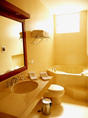 Superior Suite, 1 King Bed | Bathroom | Combined shower/tub, free toiletries, hair dryer, towels