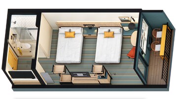 A hotel room layout with two beds, a bathroom, a desk, and a small seating area.