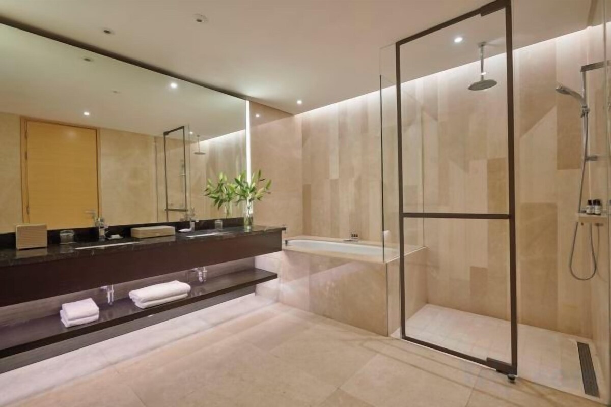 Designer toiletries, hair dryer, bathrobes, slippers