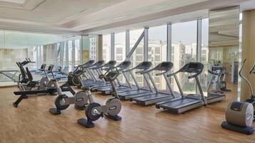 A gym with treadmills, ellipticals, and weight machines.