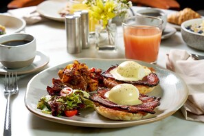 A breakfast plate with eggs, bacon, and a side salad. - Hyatt Regency Riyadh Olaya (Riyadh)