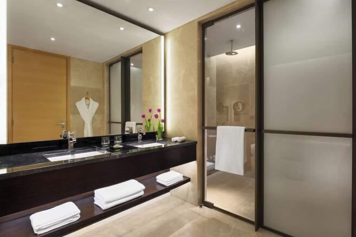Designer toiletries, hair dryer, bathrobes, slippers