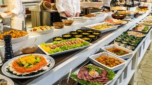 A buffet with various food items and chefs preparing food. - Select Grand Kagayamanaka (Kaga)