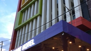A multi-story hotel with a prominent sign reading "Square Hotel". - Msquare Hotel (Palembang)