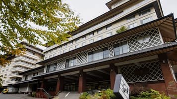 Experience the charm of this traditional hotel, featuring a grand entrance and spacious balconies with large windows.