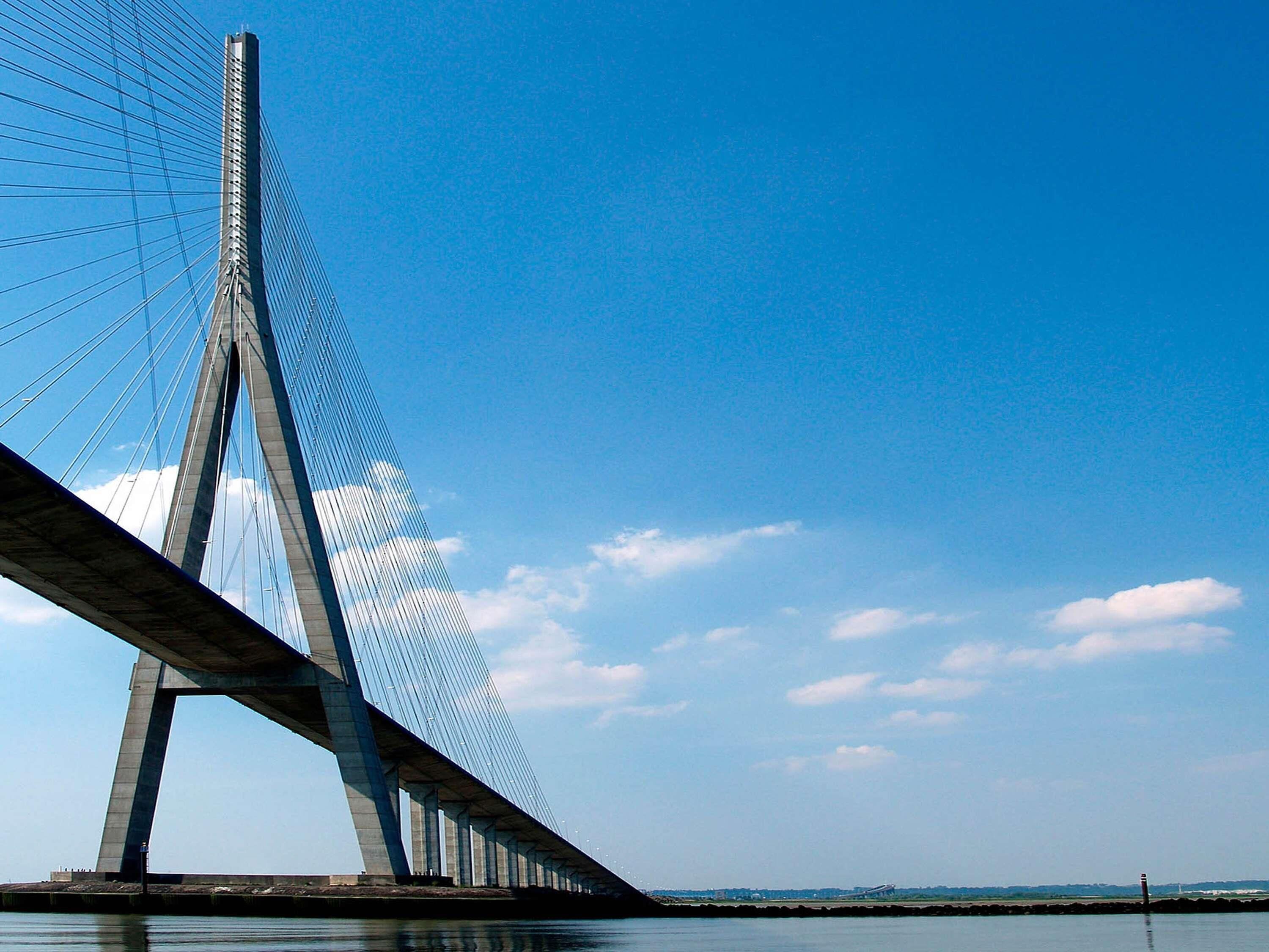 A cable-stayed bridge with a clear sky.
