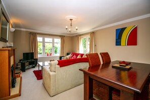 Luxury Apartment, 2 Bedrooms | Living room | 32-inch flat-screen TV with digital channels, TV, DVD player